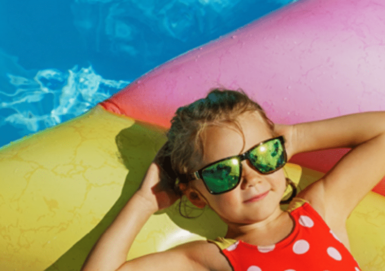 A child enjoying a home pool